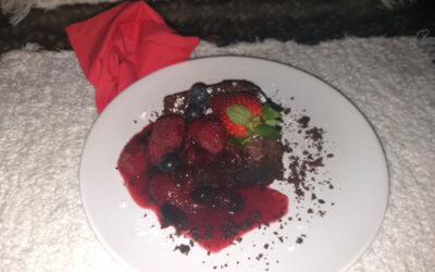 Olive oil chocolate brownies and a mixed berry sauce.
